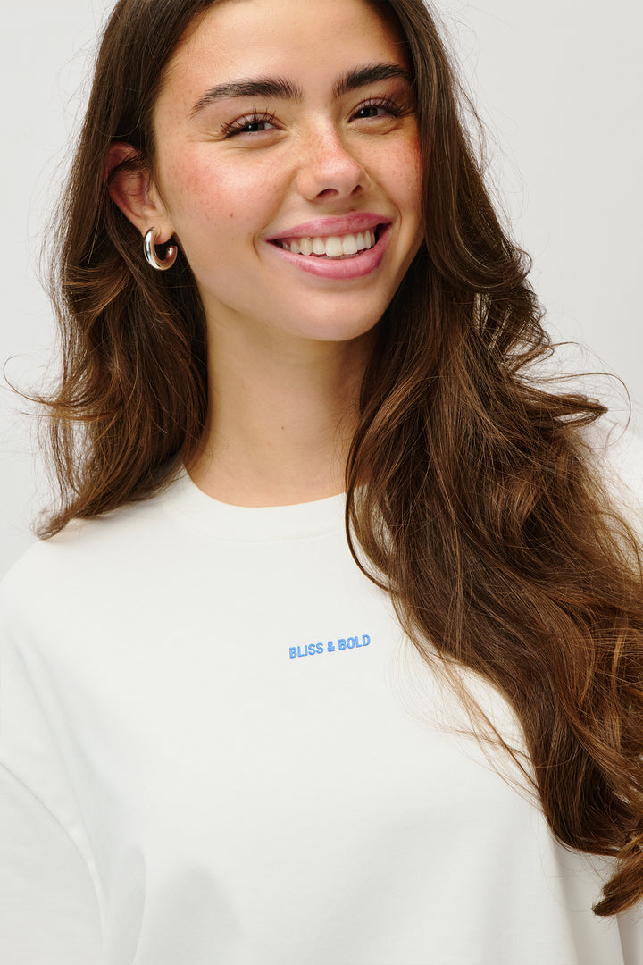 OVERSIZED TSHIRT OFF WHITE LOVE SURROUNDS ME